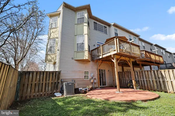 a view of a wooden house with a yard