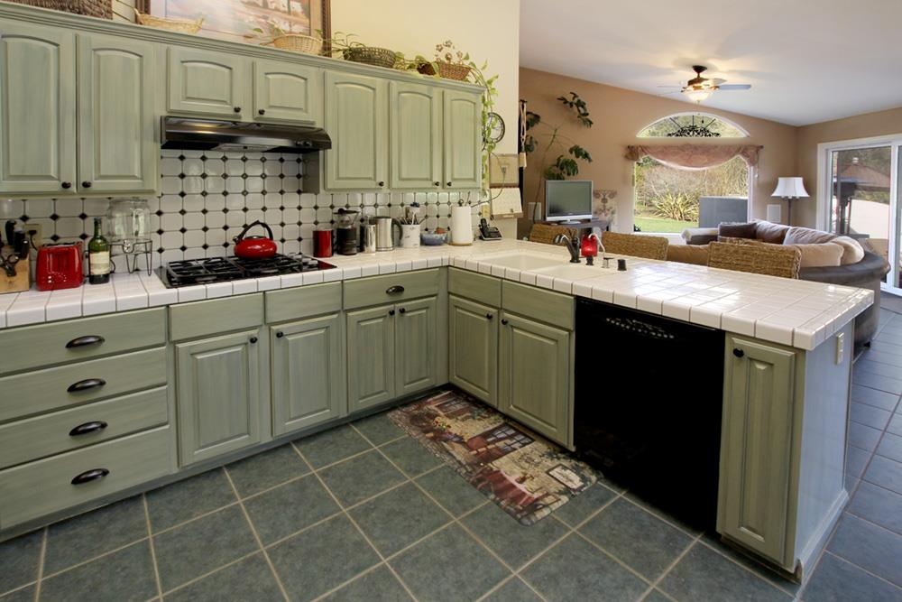 5 Nunes Road Watsonville, CA 95076 - Photo 11 of 41 a kitchen with stainless steel appliances granite countertop a sink a stove and cabinets