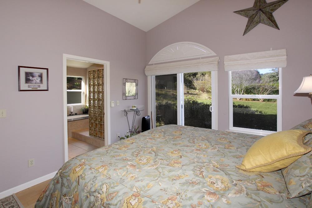 5 Nunes Road Watsonville, CA 95076 - Photo 16 of 41 a bedroom with a bed and a large window