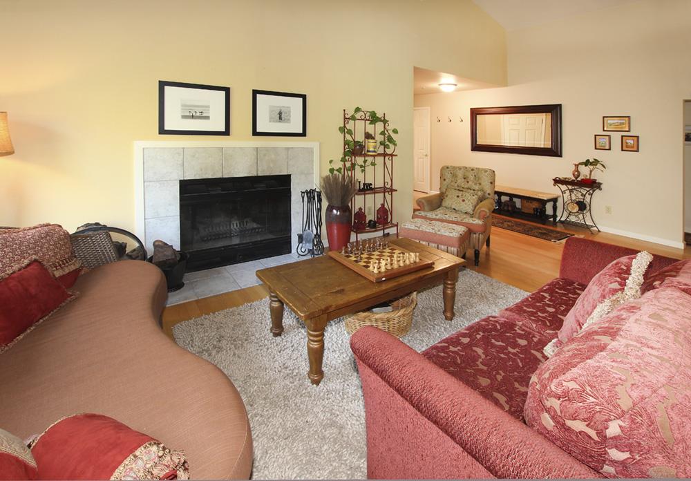 5 Nunes Road Watsonville, CA 95076 - Photo 8 of 41 a living room with furniture and a fireplace