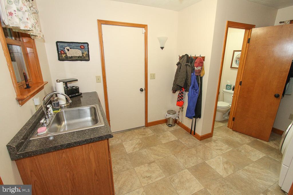 609 Weaver Road Morgantown, PA 19543 - Photo 13 of 46 laundry with half bath
