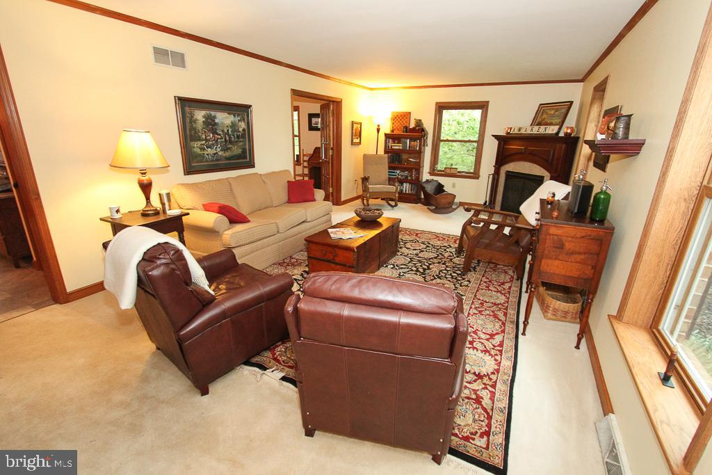 living room with corner gas fireplace