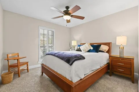 a bedroom with a bed and window