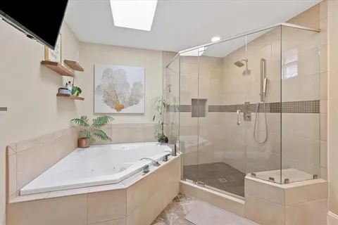 a bath tub sitting next to a shower