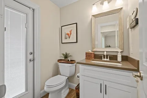 a white toilet sitting next to a bathroom sink