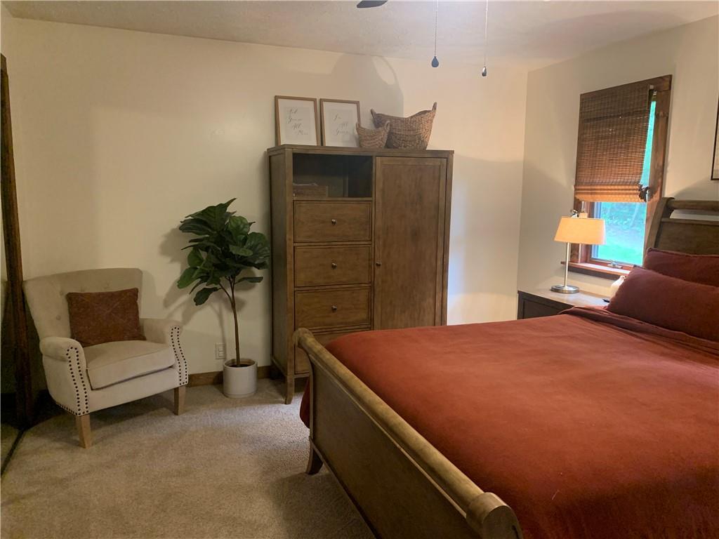 139 Hardin Run Road Georgetown, PA 15043 - Photo 12 of 50 a bed room with a bed and a couch