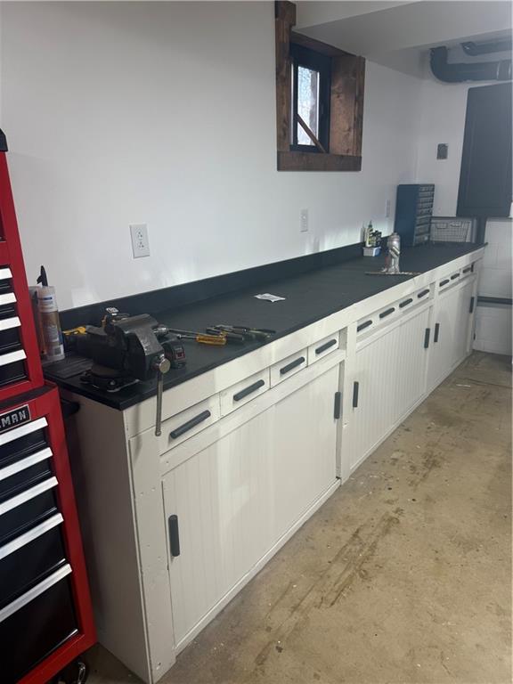 139 Hardin Run Road Georgetown, PA 15043 - Photo 39 of 50 a kitchen with granite countertop white cabinets and black appliances