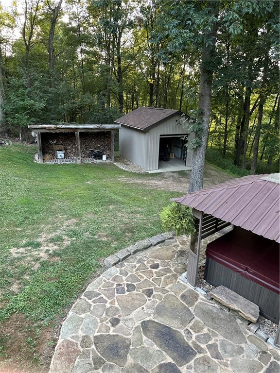 139 Hardin Run Road Georgetown, PA 15043 - Photo 48 of 50 a view of a wooden floor and a back yard with a bench