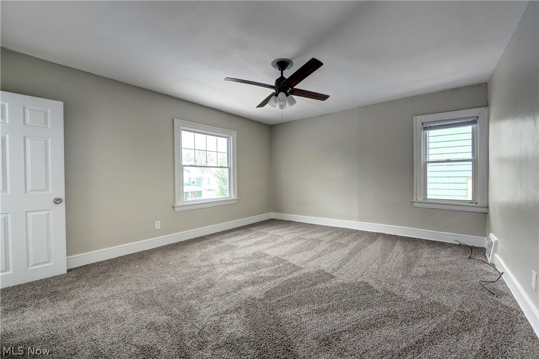 2115 Marlindale Road Cleveland Heights, OH 44118 - Photo 13 of 19 Empty room with carpet and ceiling fan