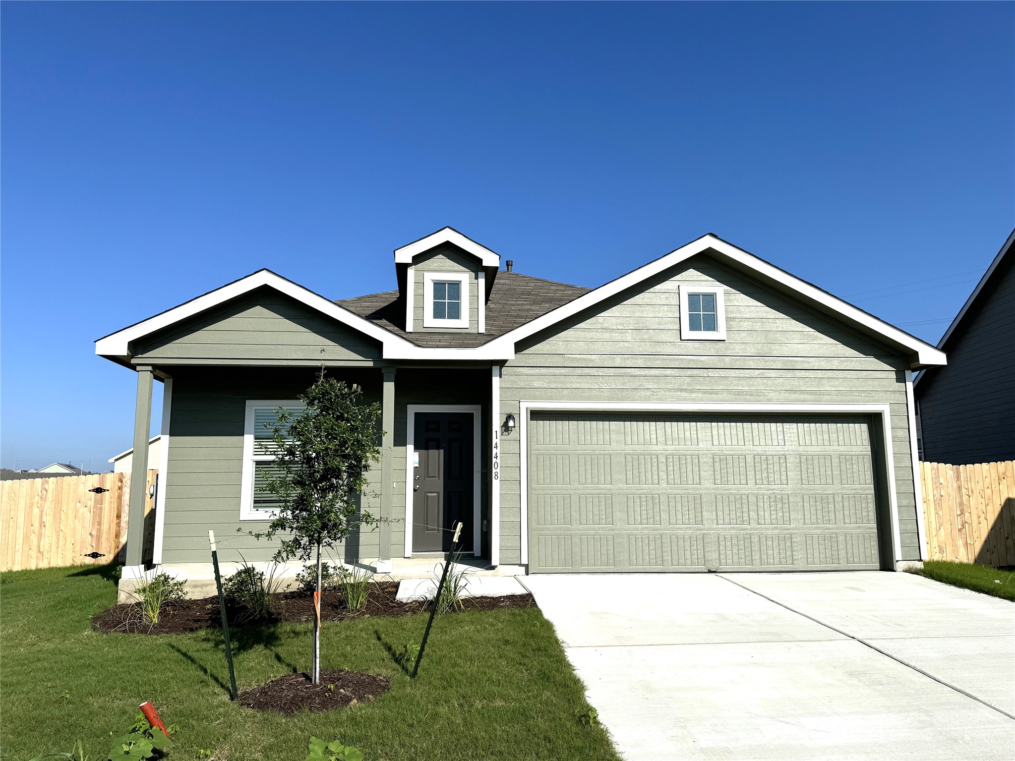 14408 Koti Way Pflugerville, TX 78660 - Photo 1 of 14 View of front of home with a garage and concrete driveway