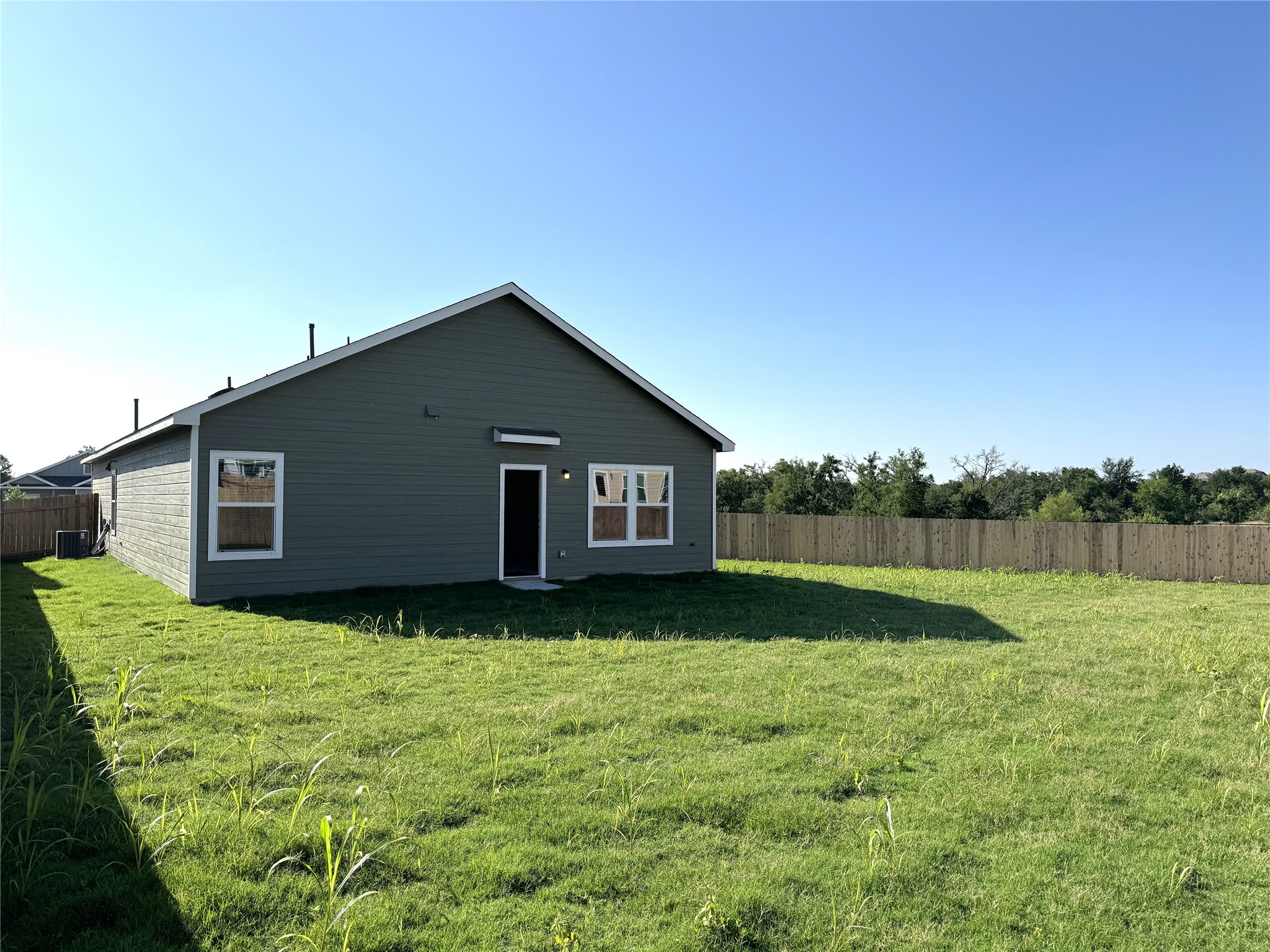 14408 Koti Way Pflugerville, TX 78660 - Photo 12 of 14 Rear view of house
