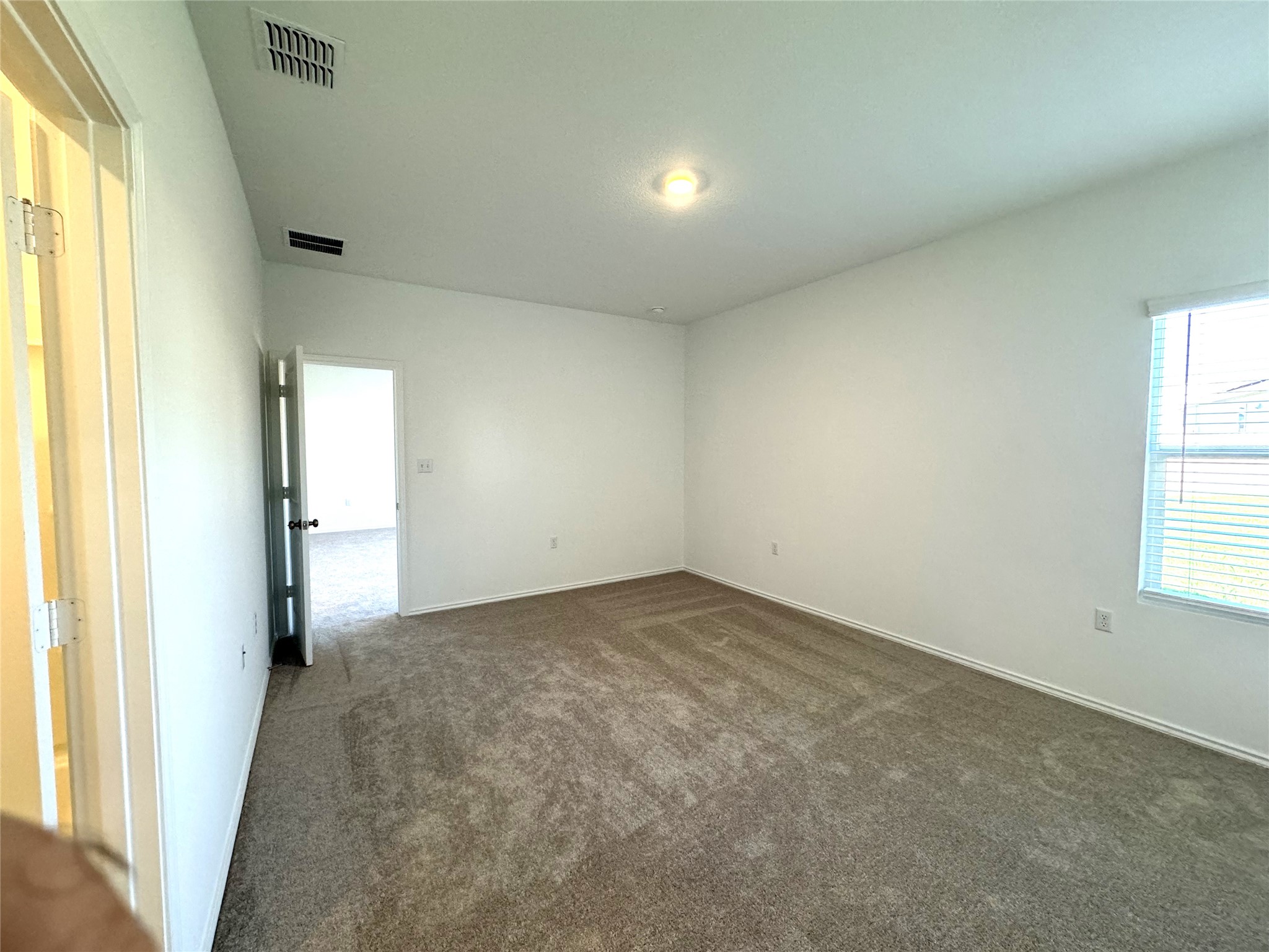 14408 Koti Way Pflugerville, TX 78660 - Photo 6 of 14 Unfurnished room featuring dark colored carpet and baseboards