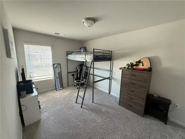 a view of room with furniture and a window