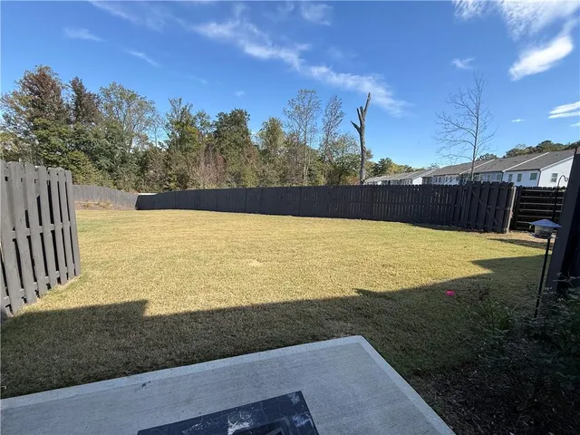 a view of a swimming pool with an outdoor seating