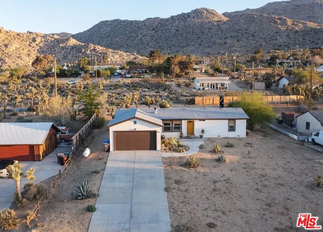 an aerial view of residential houses and outdoor space