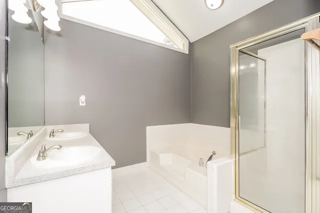 a bathroom with a sink and mirror