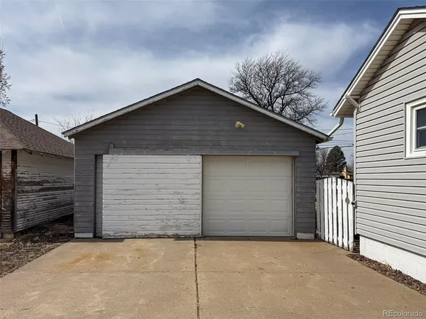a front view of a house with garage