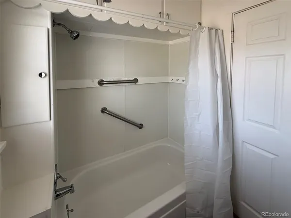 a bathroom with a shower and a toilet