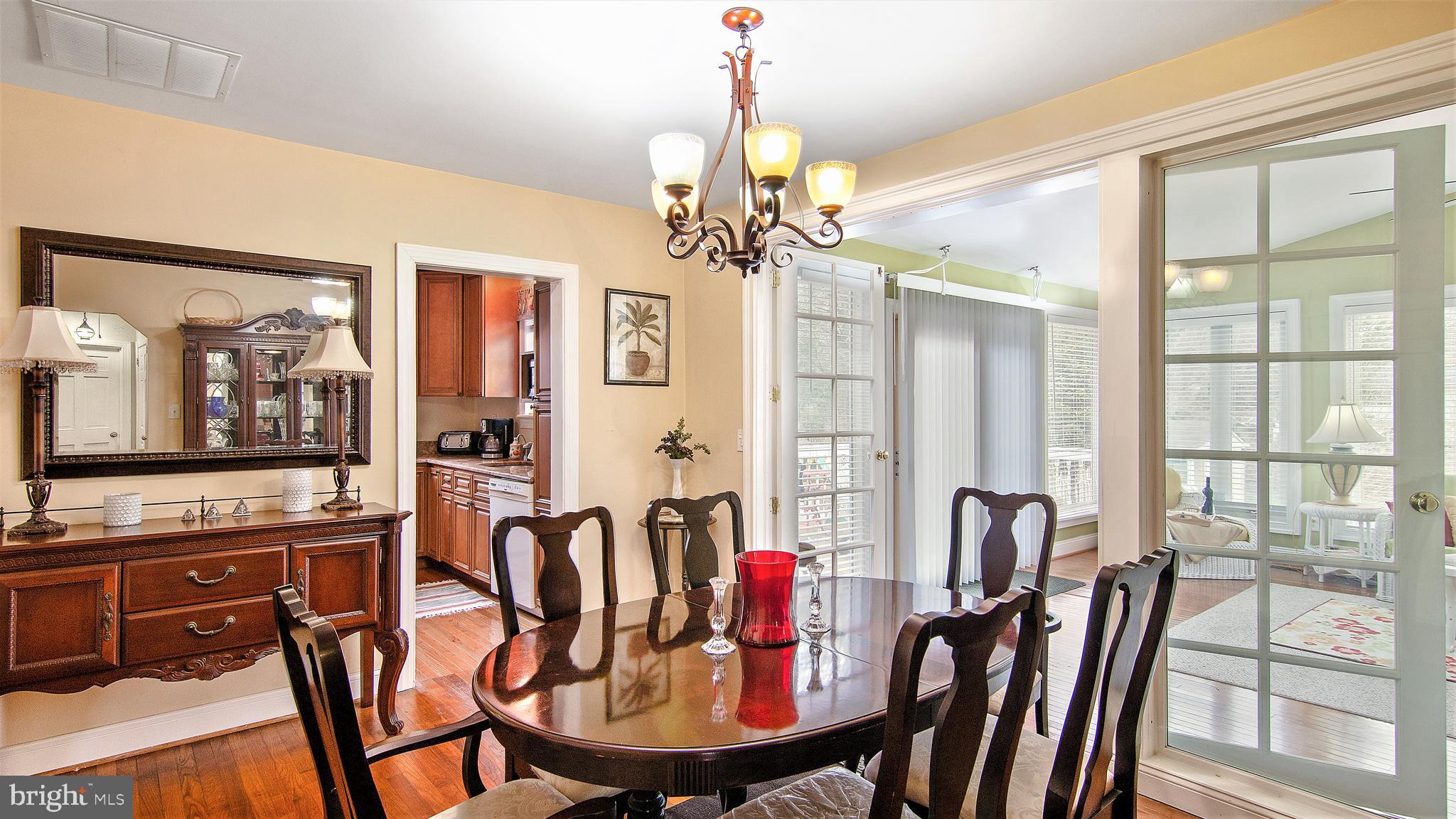 4525 Henderson Road Temple Hills, MD 20748 - Photo 14 of 46 dining room view to the kitchen and 4 season room