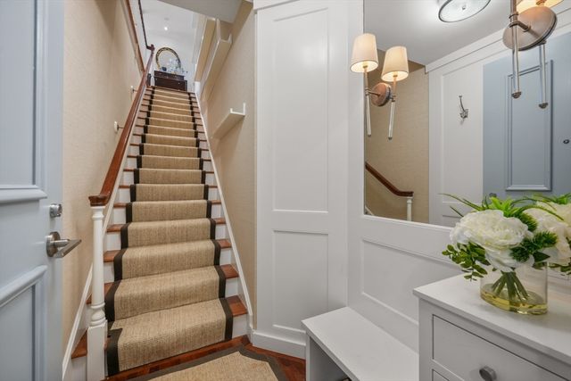 a view of entryway with wooden floor