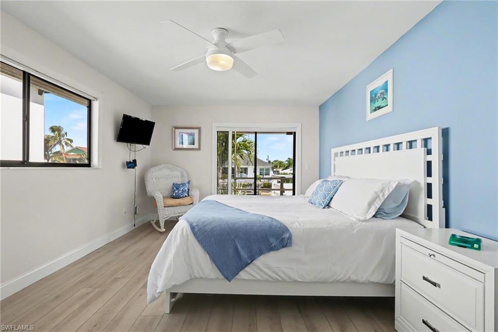 4838 Gary Road Bonita Springs, FL 34134 - Photo 15 of 29 a bedroom with a bed and window