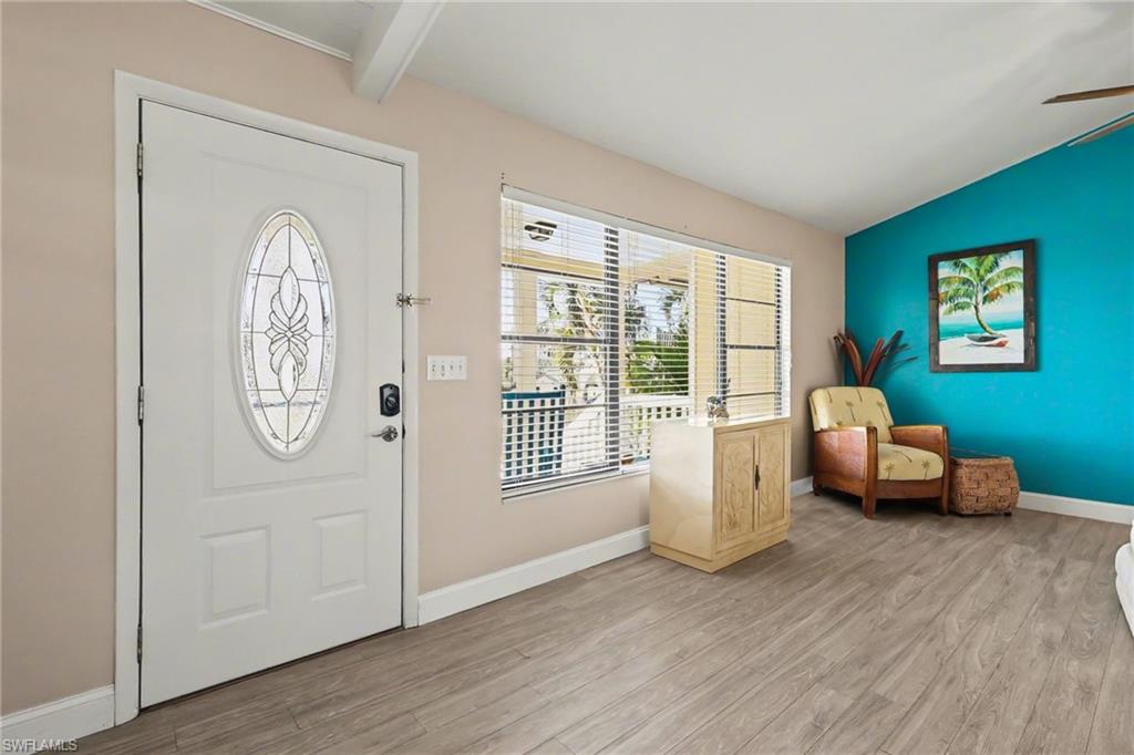 4838 Gary Road Bonita Springs, FL 34134 - Photo 9 of 29 a living room with furniture and a window