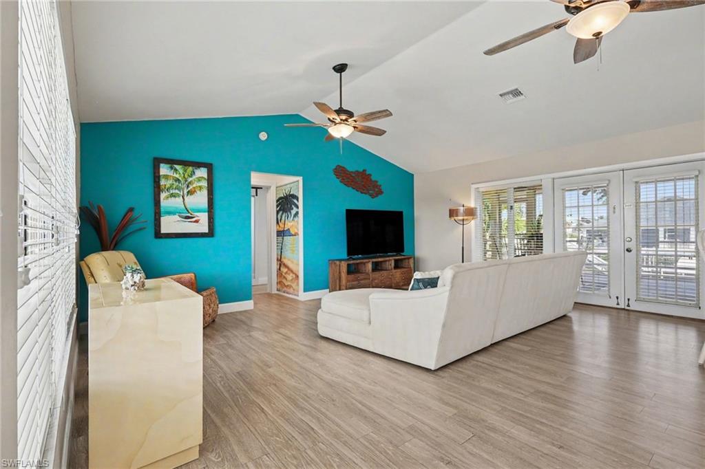 4838 Gary Road Bonita Springs, FL 34134 - Photo 10 of 29 a living room with furniture fireplace and flat screen tv