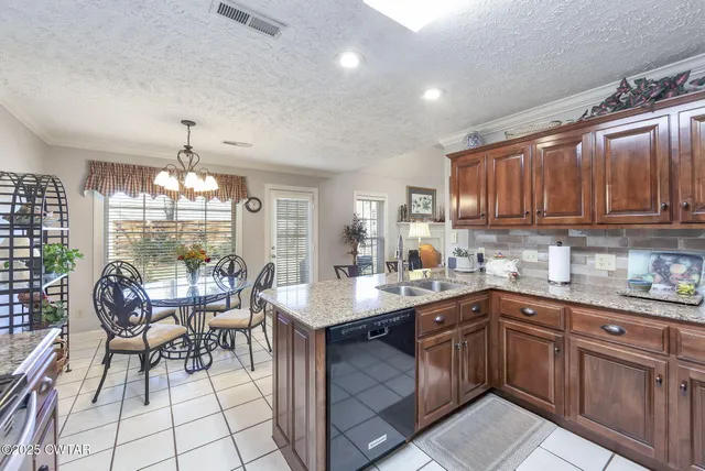 a kitchen with sink cabinets and window