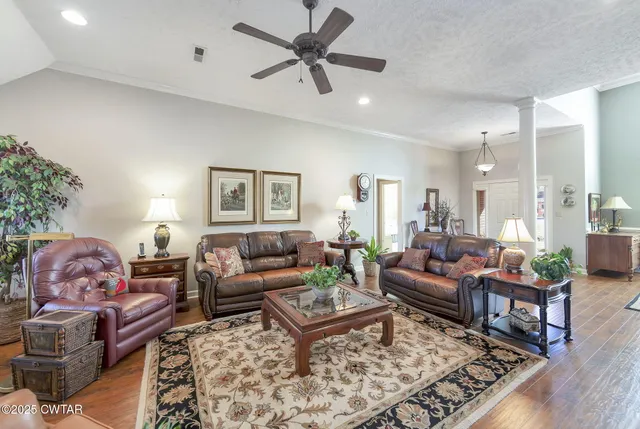 a living room with furniture and a rug