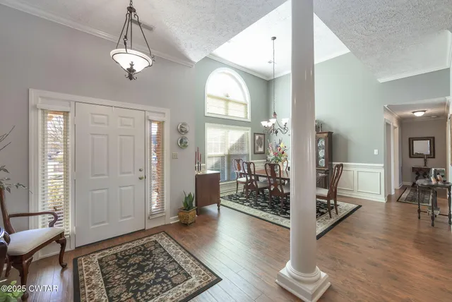 a view of a livingroom with furniture and hardwood floor