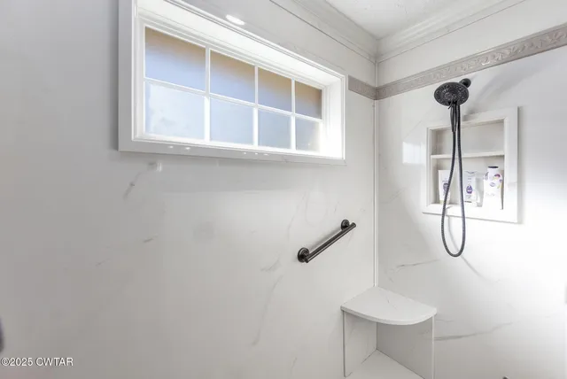 a view of a swimming pool with a patio