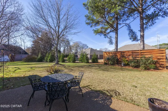 a front view of a house with yard and porch