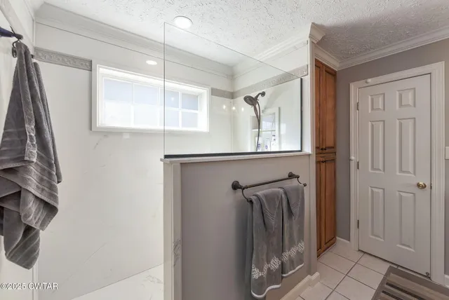 a bathroom with a shower and a sink