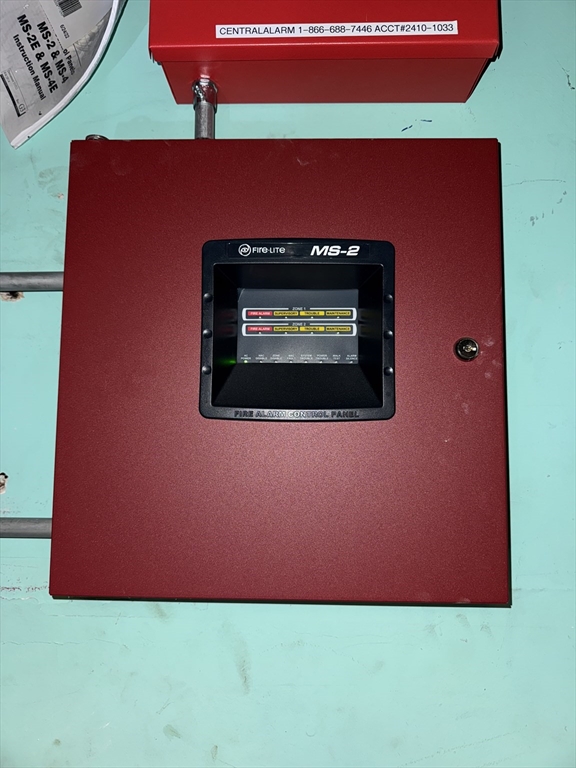 28 Grand Street Lowell, MA 01851 - Photo 13 of 23 a view of an empty room with a fireplace and wooden floor