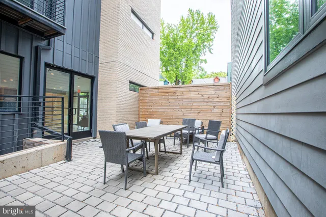 a view of a patio with couple of chairs