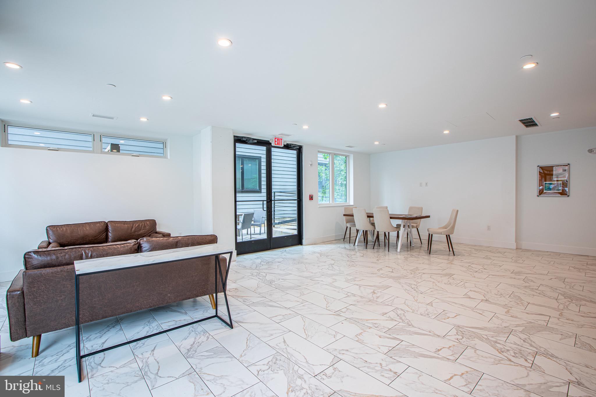 1016 17th Place Northeast, Unit 8 Washington, DC 20002 - Photo 8 of 21 a living room with furniture