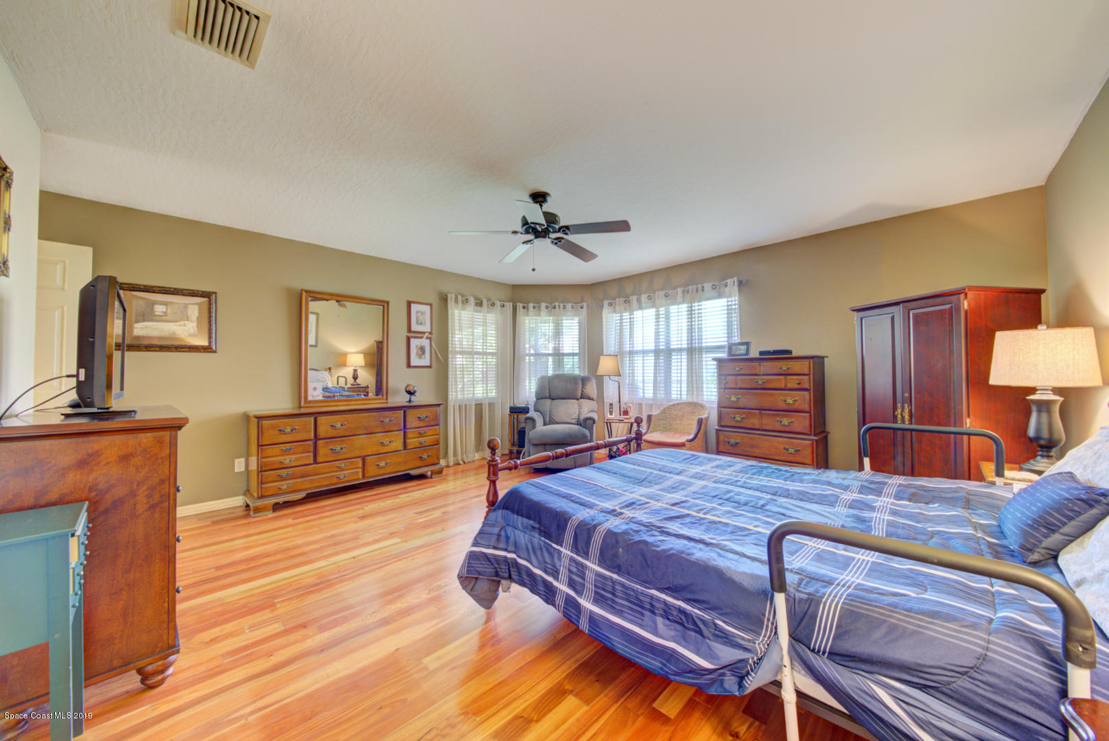 1235 Pemberton Trail Malabar, FL 32950 - Photo 20 of 32 master bedroom with corner windows