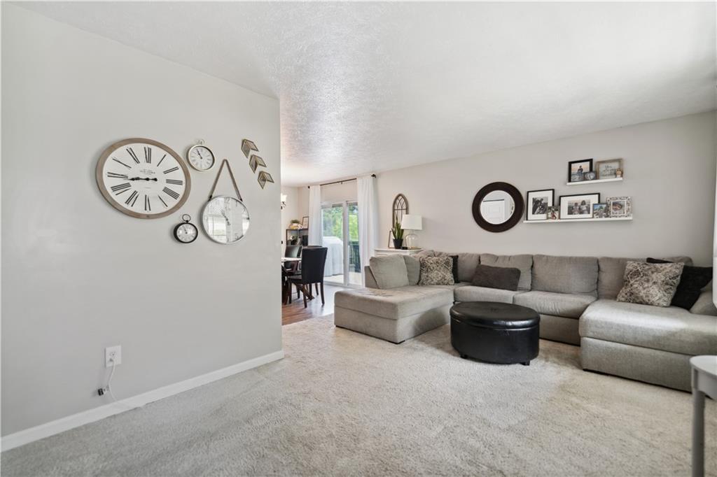 65 Wilson Avenue Cecil, PA 15321 - Photo 8 of 43 The large living room will soon be filled with your laughter...