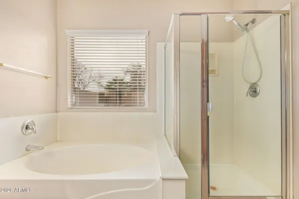 a white bath tub sitting next to a window