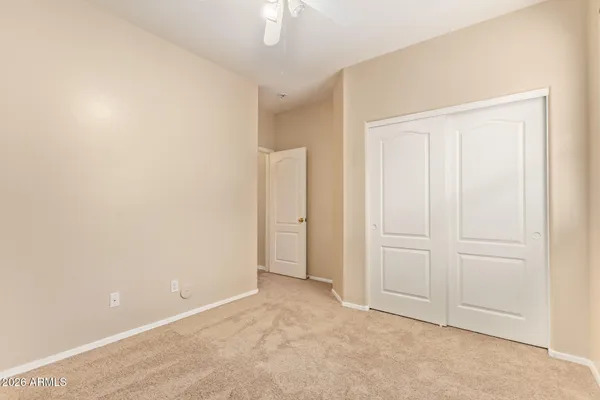 an empty room with closet area