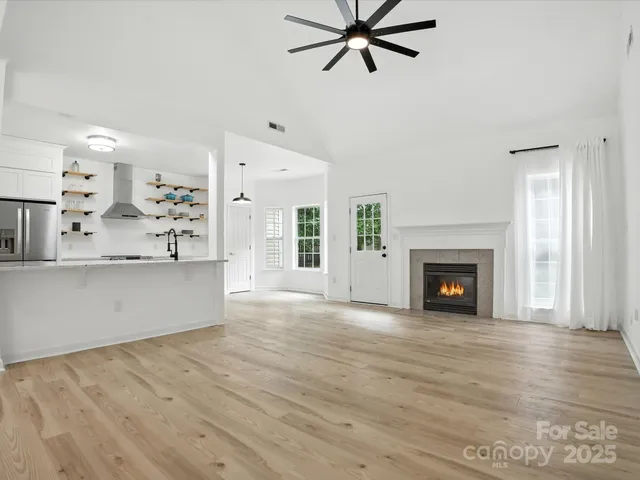 a view of a kitchen with microwave and cabinets
