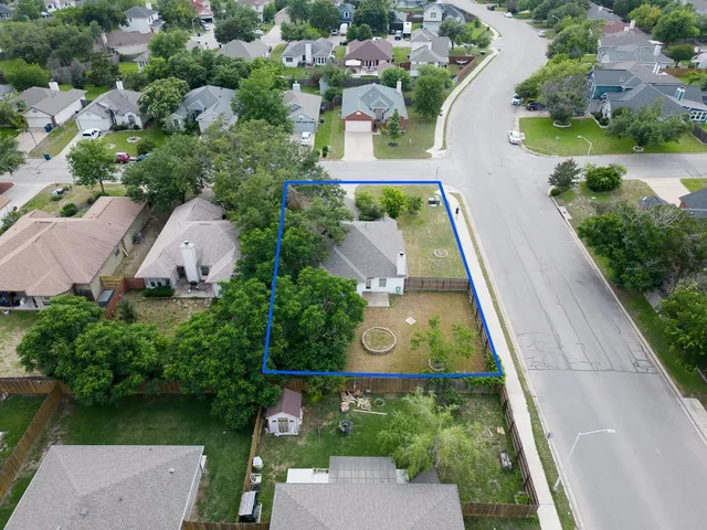 an aerial view of house with yard swimming pool and outdoor seating