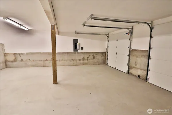 a view of staircase with white walls and a window