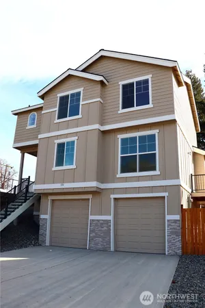 a front view of a house with a garage