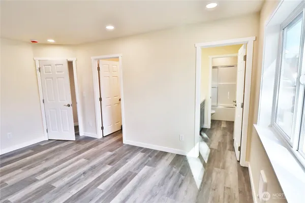 a view of hallway with wooden floor