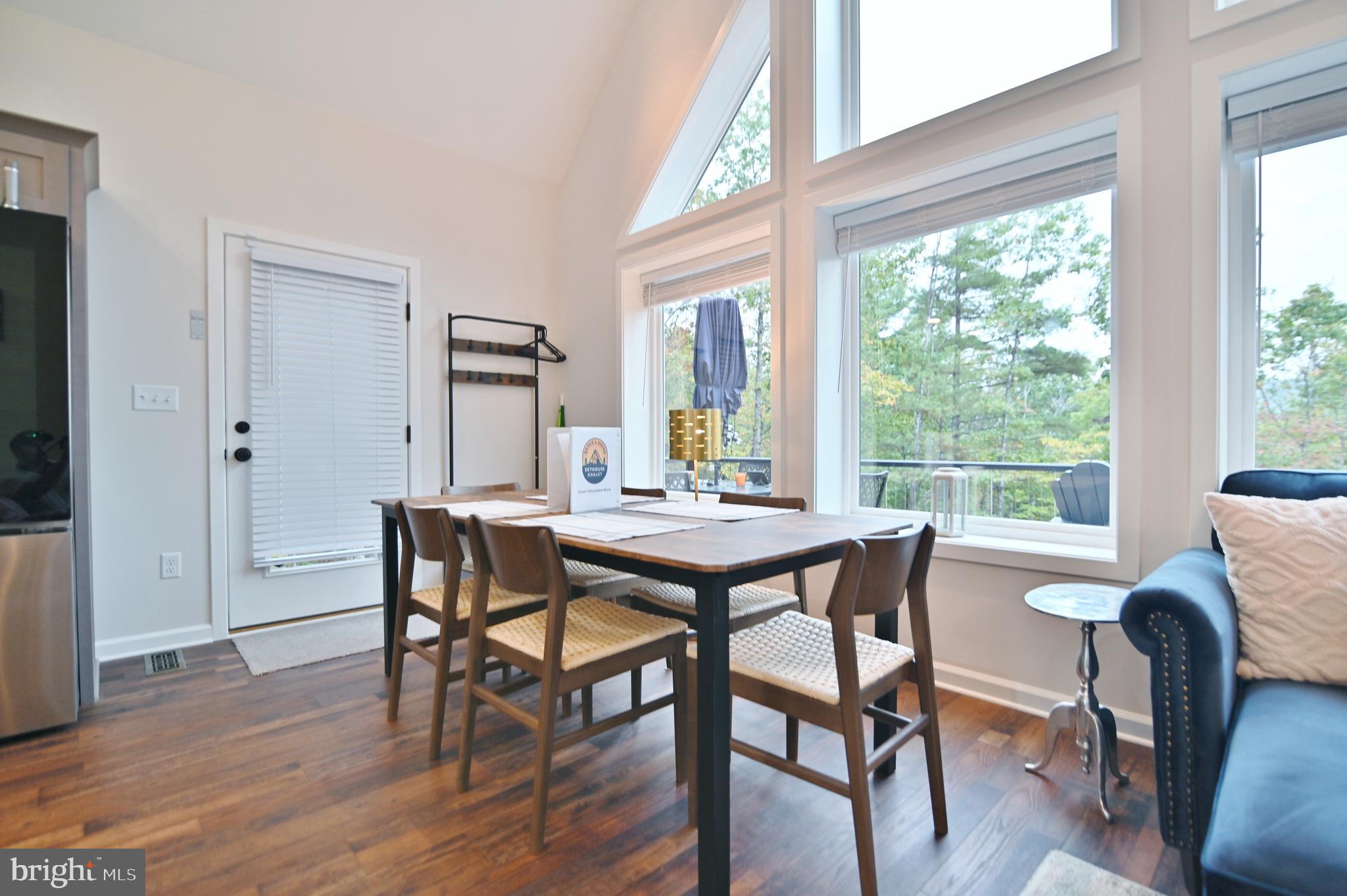 5448 Crooked Run Road Mount Jackson, VA 22842 - Photo 12 of 67 a view of a dining room with furniture and wooden floor