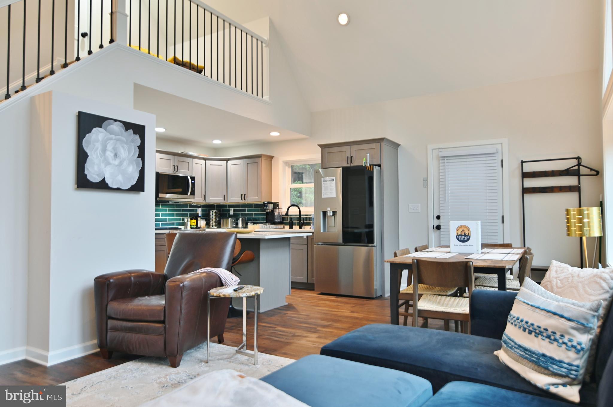 5448 Crooked Run Road Mount Jackson, VA 22842 - Photo 13 of 67 a living room with furniture and kitchen view