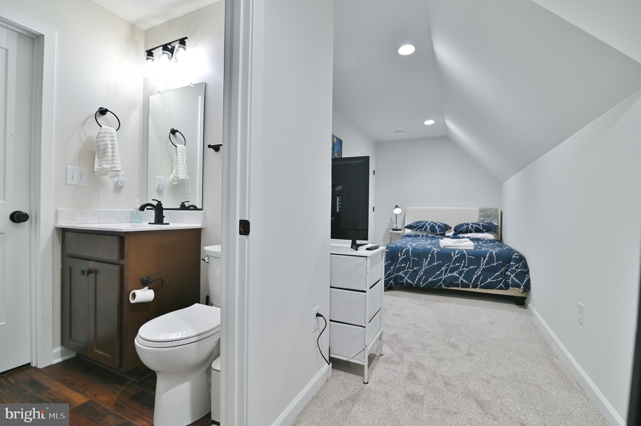 5448 Crooked Run Road Mount Jackson, VA 22842 - Photo 30 of 67 a bedroom with a bed and a mirror