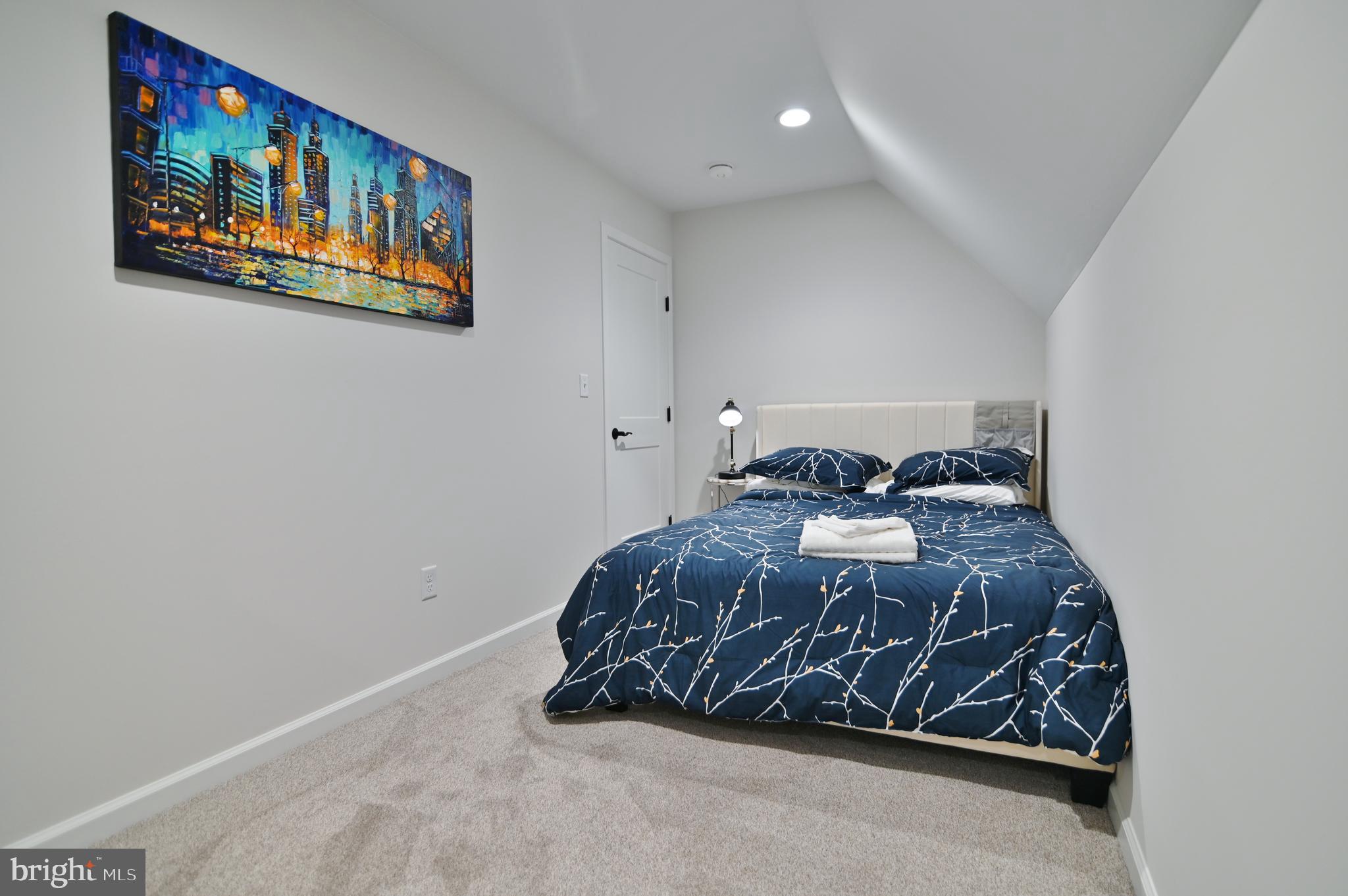 5448 Crooked Run Road Mount Jackson, VA 22842 - Photo 33 of 67 a bed sitting in a bedroom next to a painting on the wall