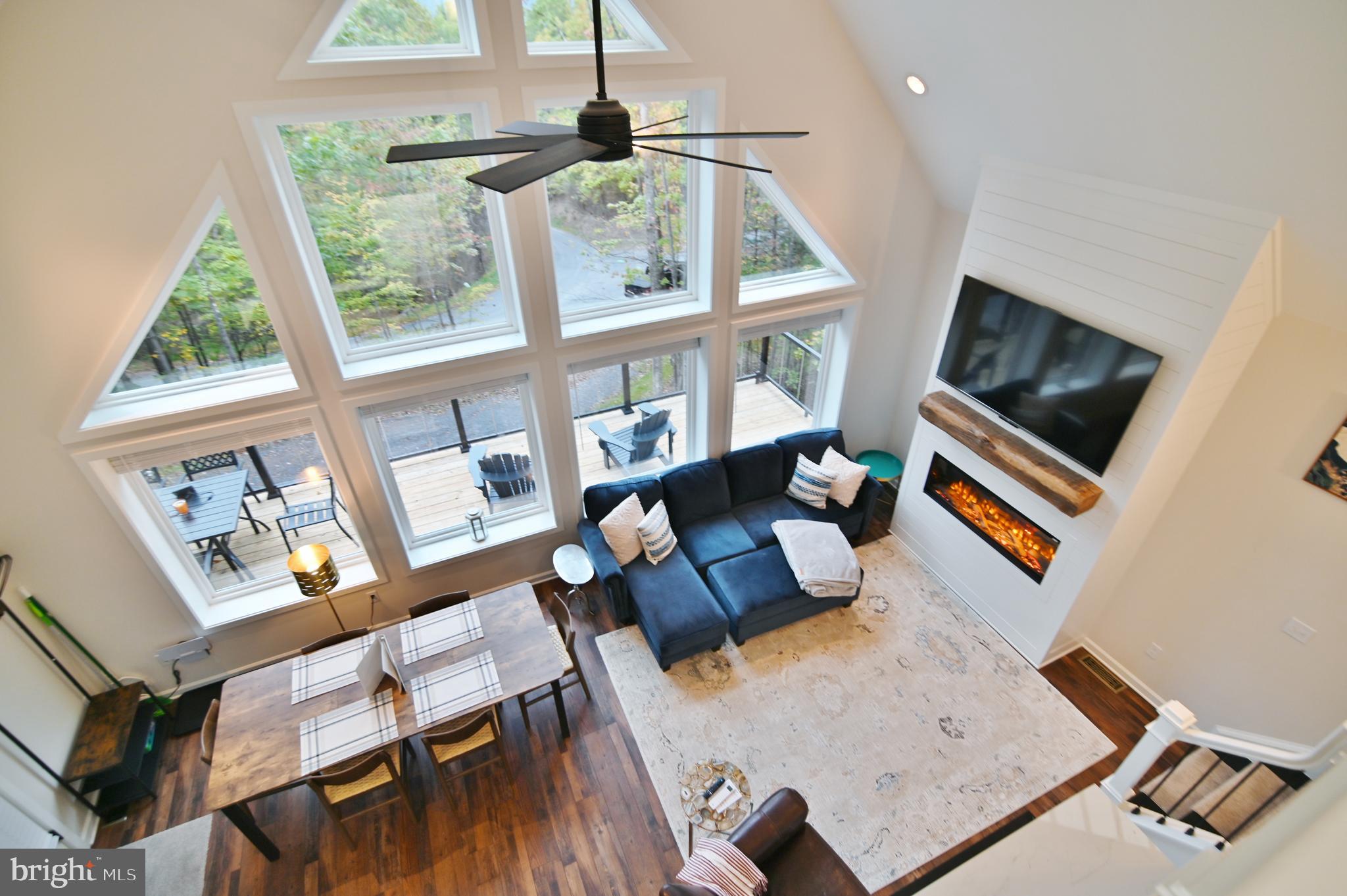 5448 Crooked Run Road Mount Jackson, VA 22842 - Photo 36 of 67 a living room with furniture and a flat screen tv